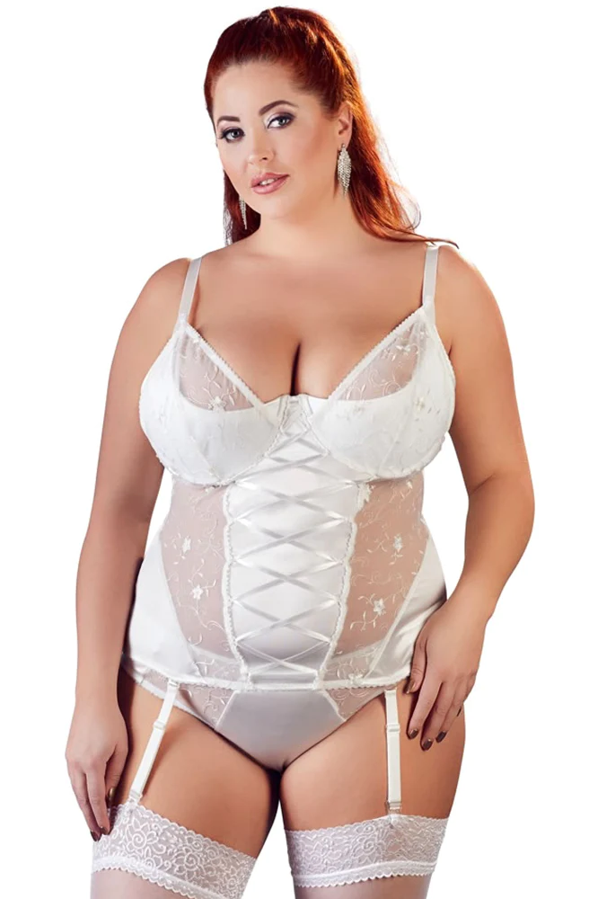 Woman wearing a white lace lingerie set on a white background