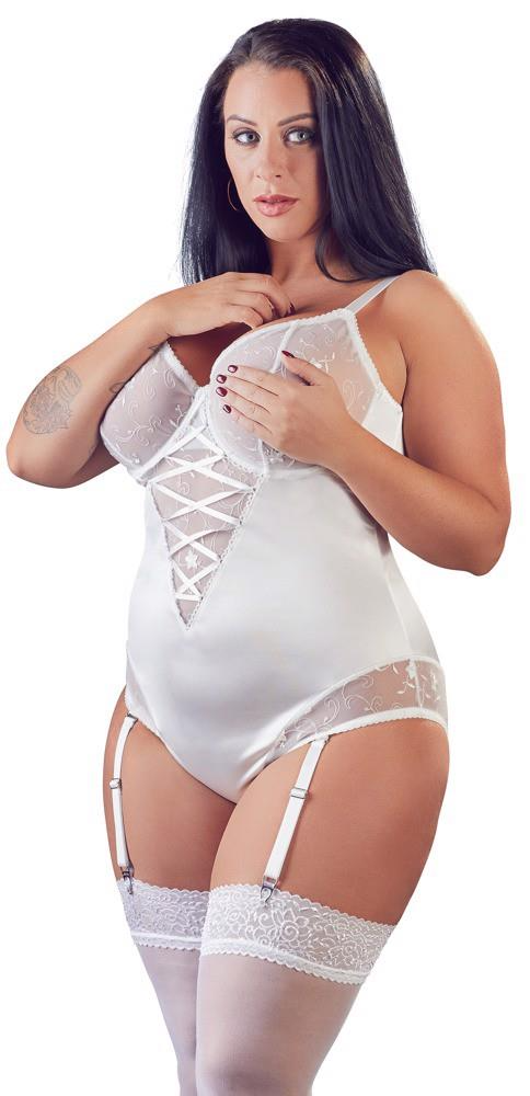 Woman wearing a white lace lingerie set on a white background