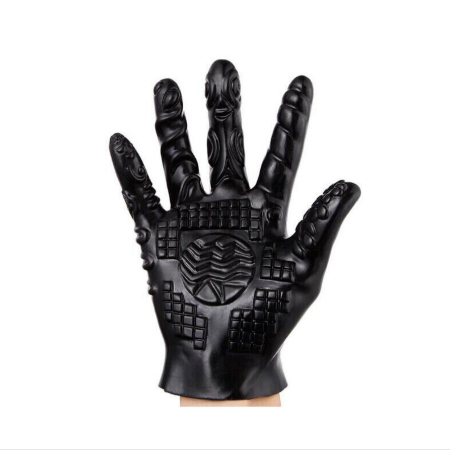 Black leather glove with intricate design on a white background