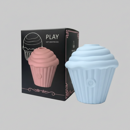 Cupcake-shaped product with pink and blue colors next to its packaging on a gray background