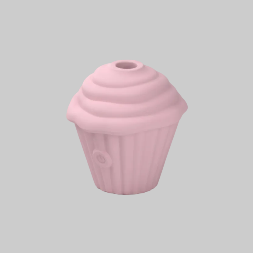 Pink cupcake-shaped object on a gray background