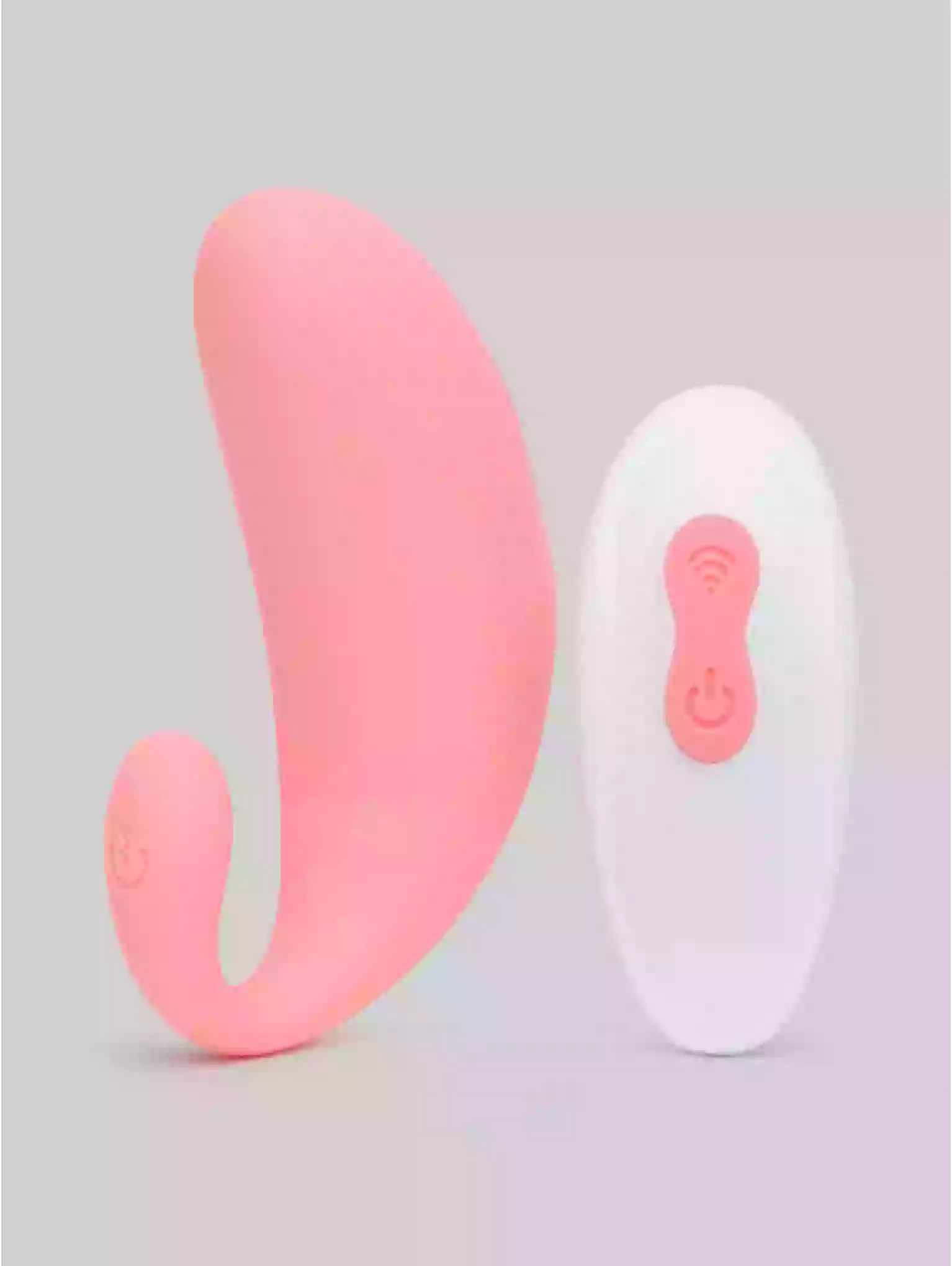 Pink and white electronic device on a light gray background