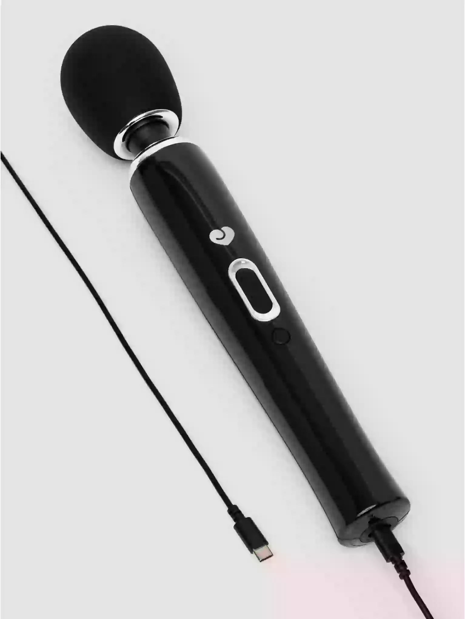Black microphone with a cable on a light gray background