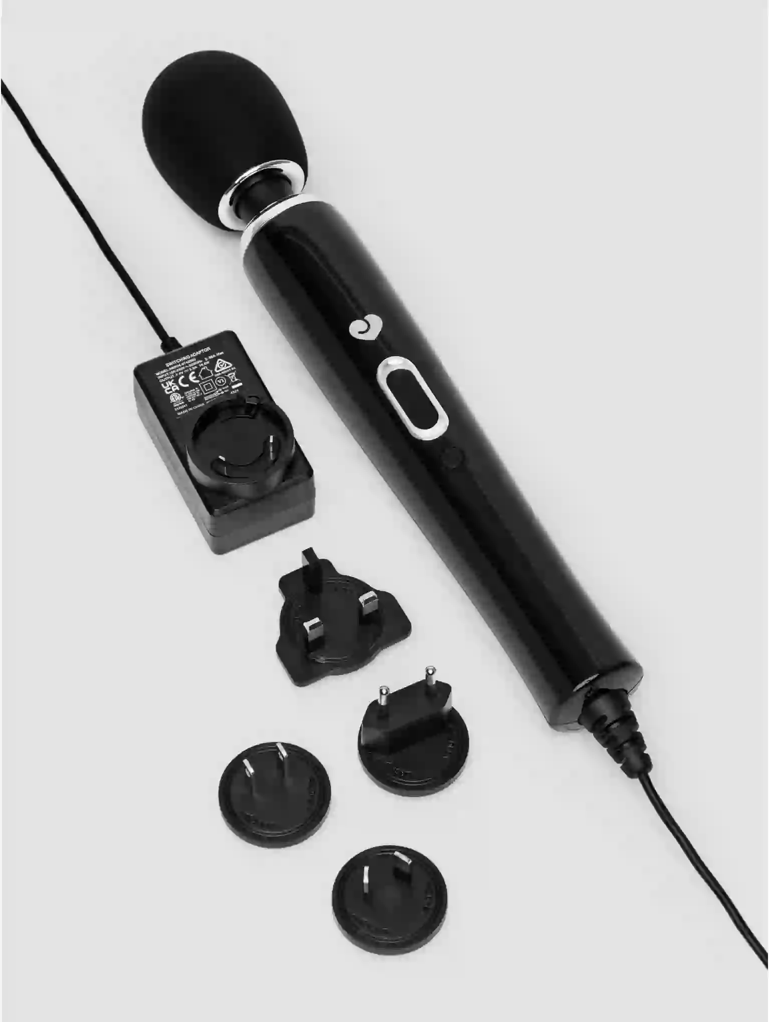 Black handheld device with attachments on a white background