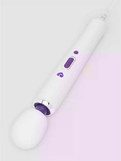White and purple hair straightener on a light purple background
