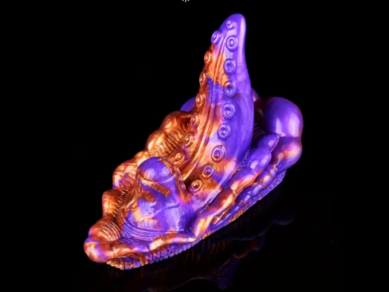 Colorful octopus-like sculpture on a black background
