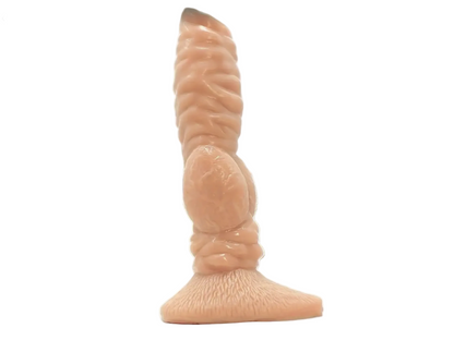 Realistic silicone model of a penis on a white background