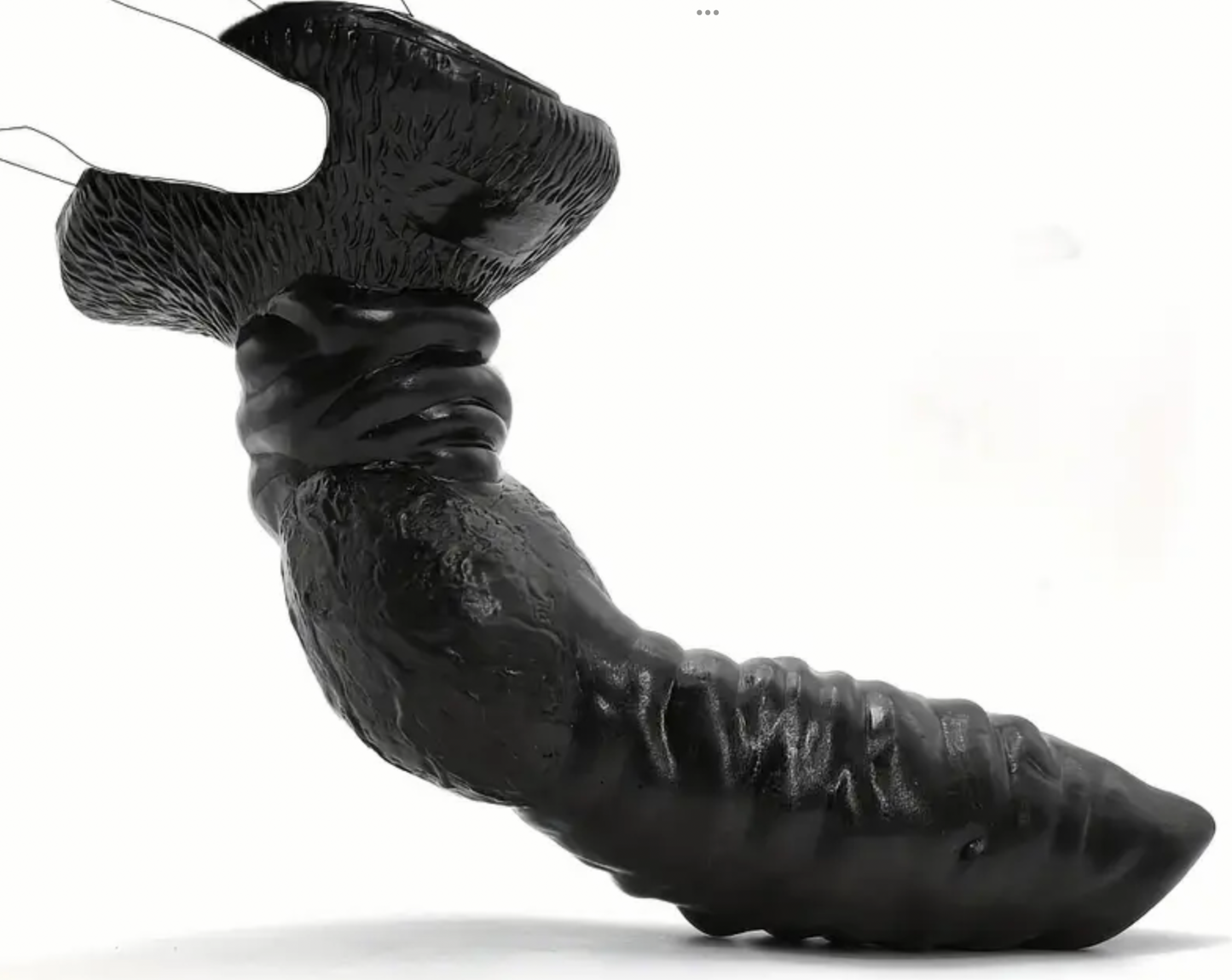 Black rubber duck with textured surface on a white background