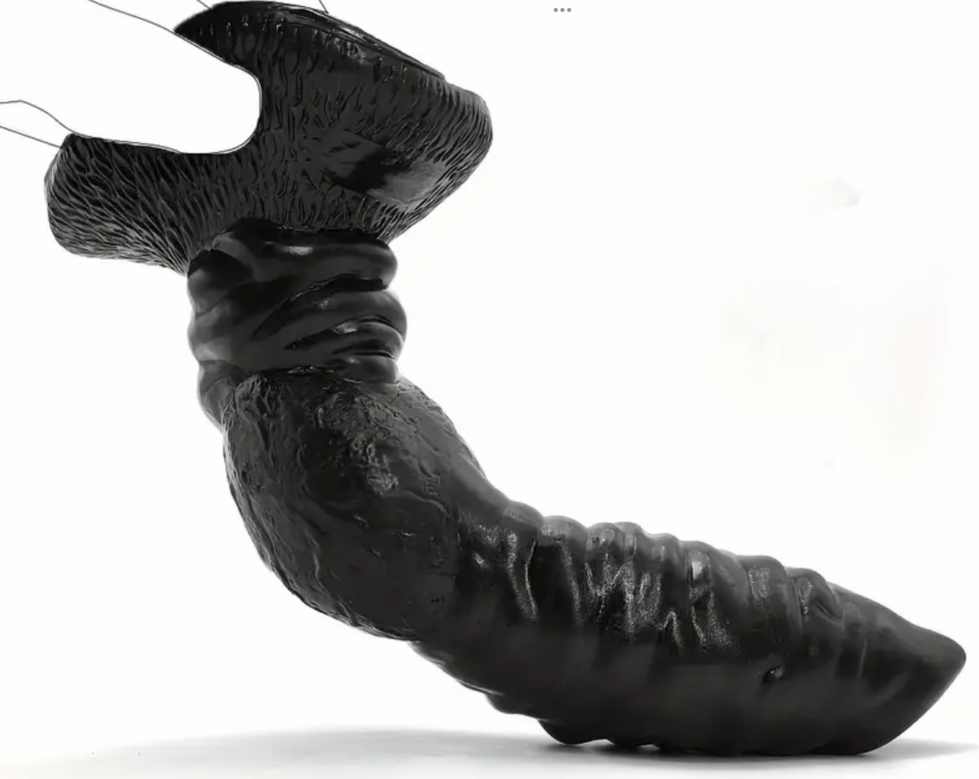 Black rubber duck with textured surface on a white background