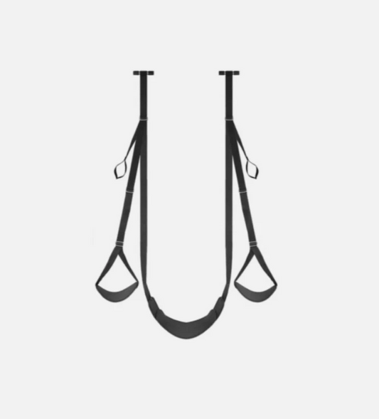 Black exercise straps on a light gray background