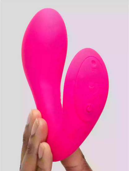 Pink silicone sheath held by a hand against a light gray background