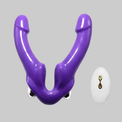 Purple plastic tool on a gray background with a small white object and logo in the corner.