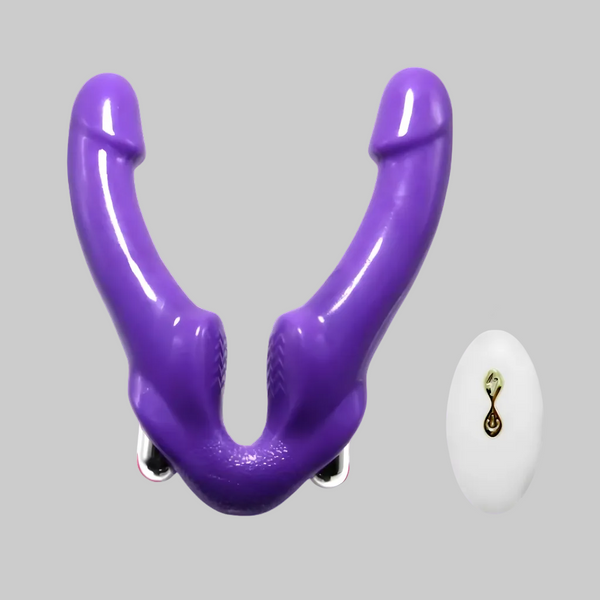 Purple plastic tool on a gray background with a small white object and logo in the corner.