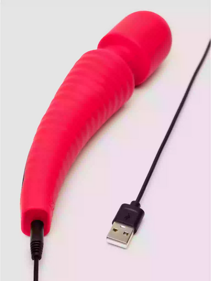 Red silicone wand with USB cable on a light gray background