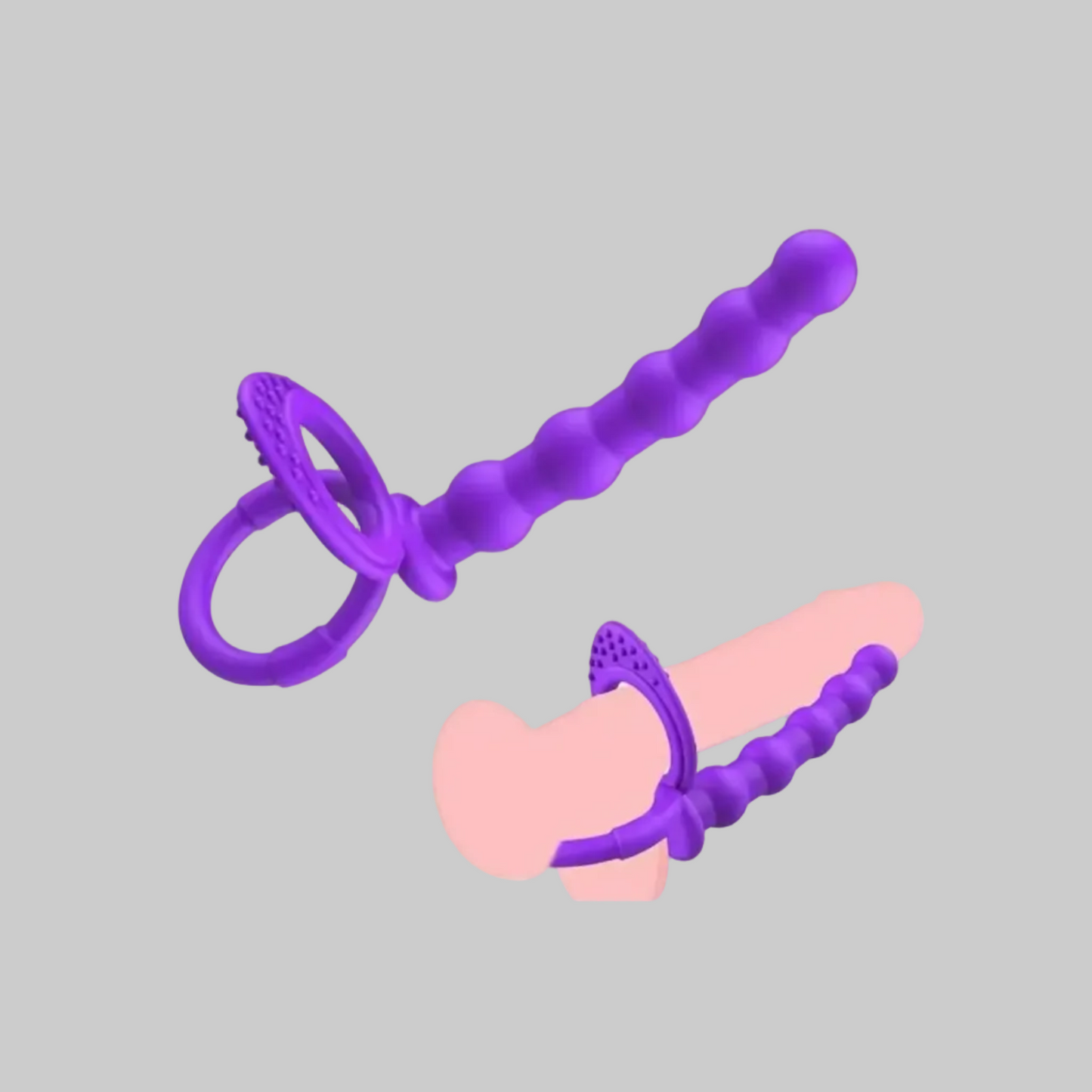 Purple and pink plastic tool on a gray background