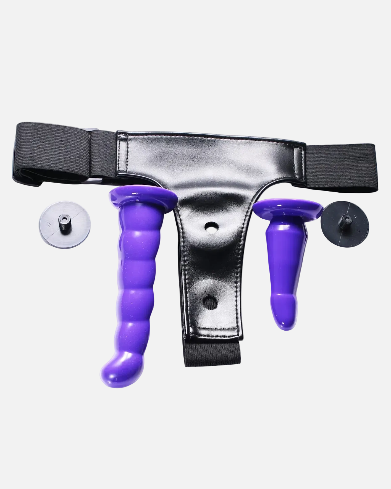 Silver garter belt with purple clitoral and anal plugs on a white background