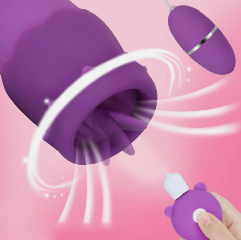 Purple silicone cleaning tool with a hand holding it against a pink background