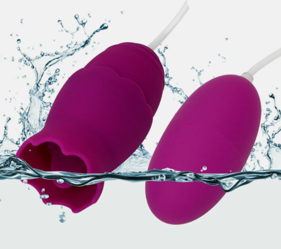 Purple silicone product with water droplets on a white background