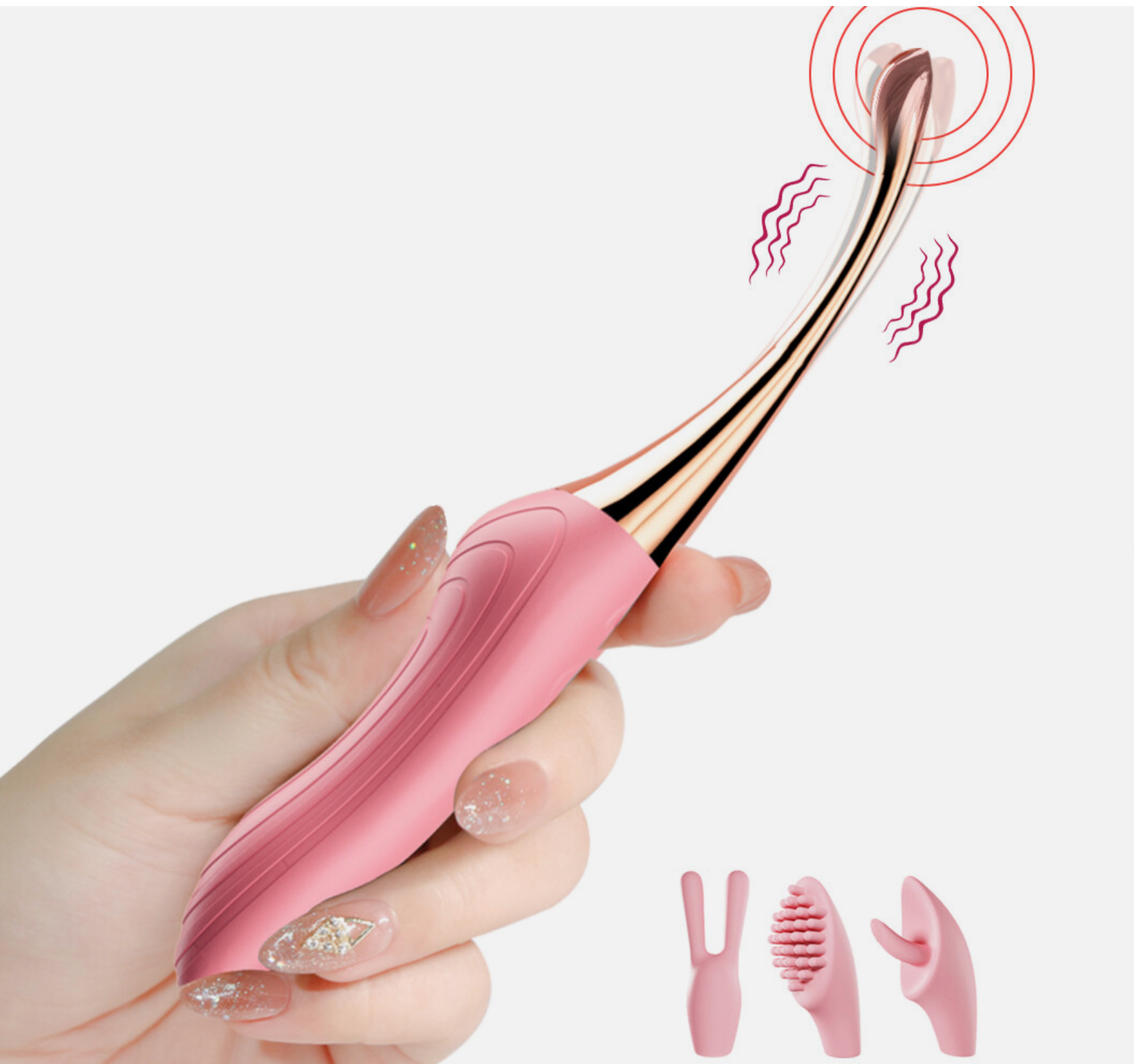 Pink and gold ear cleaning tool held by a hand with a white background