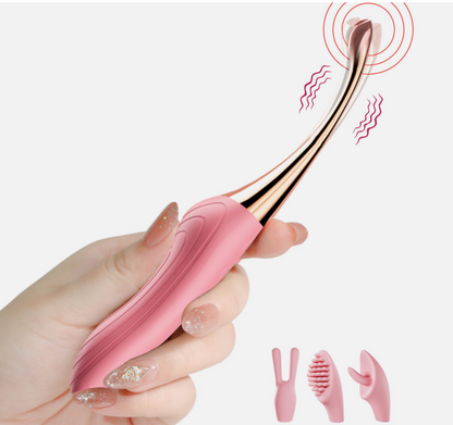 Pink and gold ear cleaning tool held by a hand with a white background