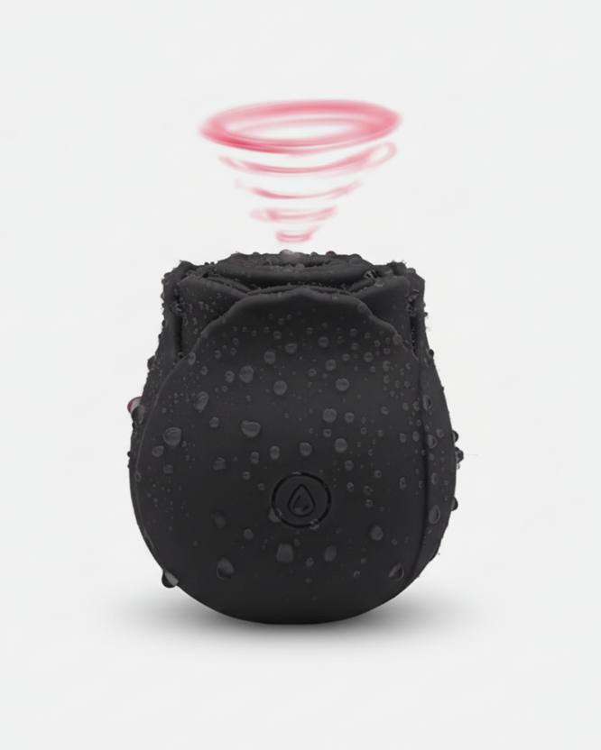 Black textured ball with a pink circular object above it on a white background