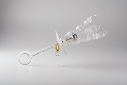 Clear dragonfly-shaped object on a gray background