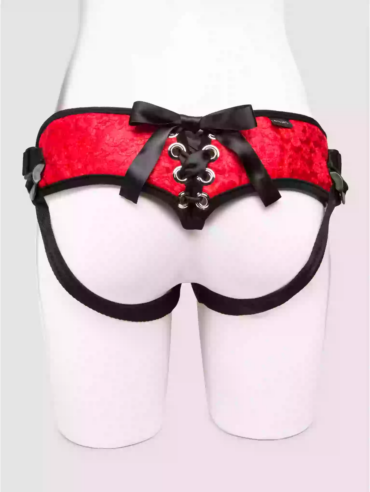 Red and black harness on a mannequin against a white background