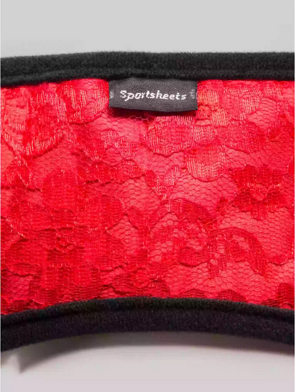 Red lace fabric with a 'Sportsheets' label on a gray background