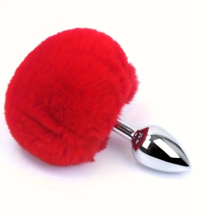 Red fluffy ball with a metallic base on a white background