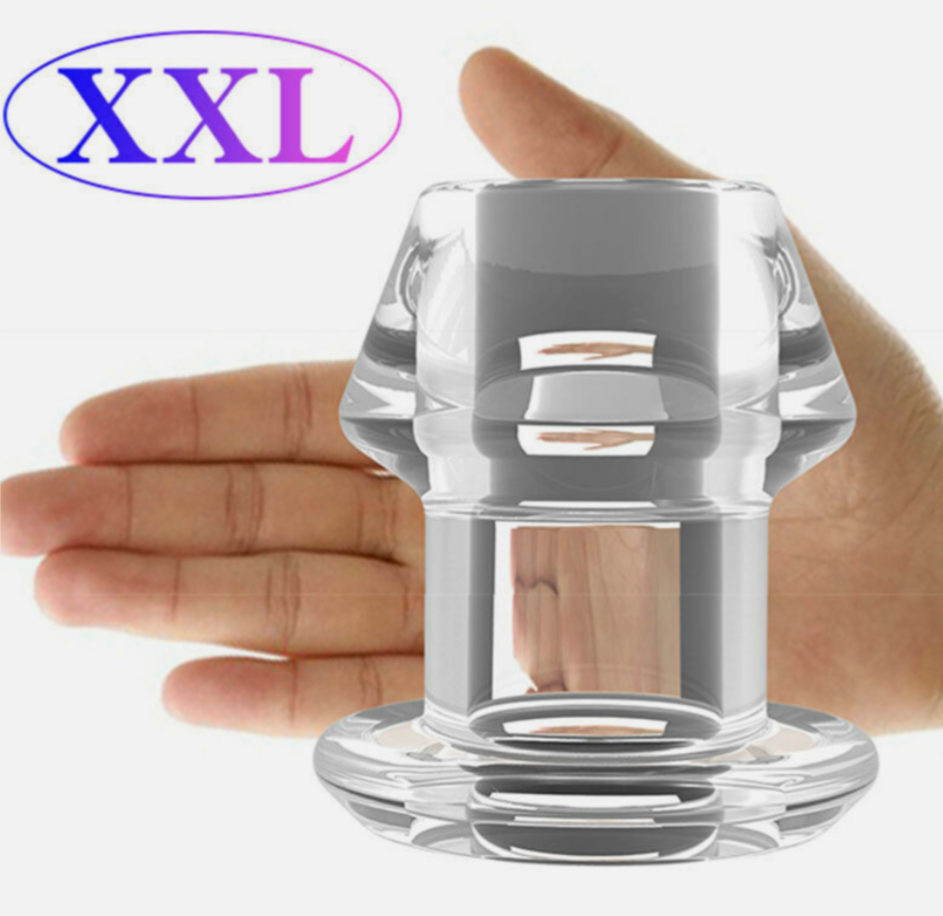 Clear glass object held in a hand with 'XXL' label above