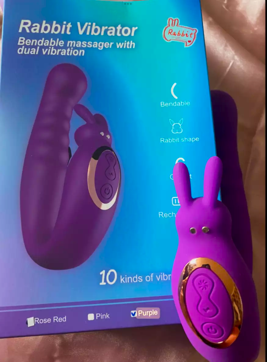 Purple rabbit-shaped vibrator with packaging in the background