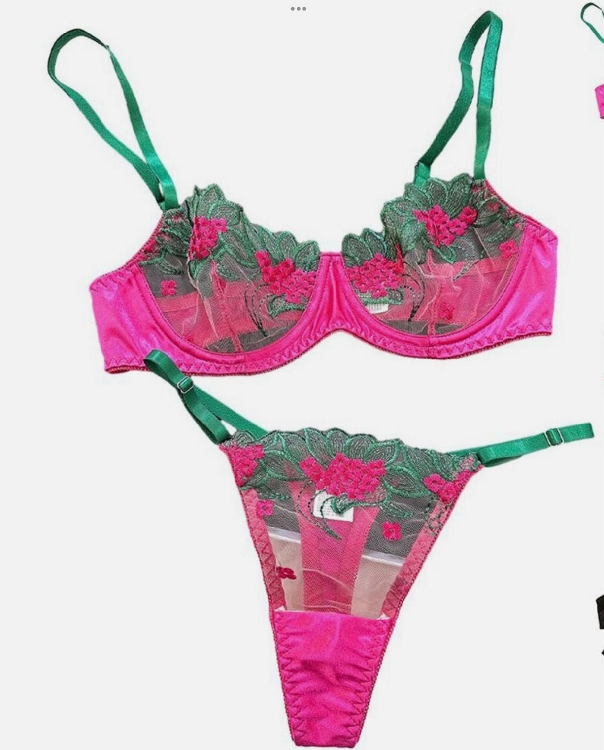 Pink and green bikini set with floral design on a white background