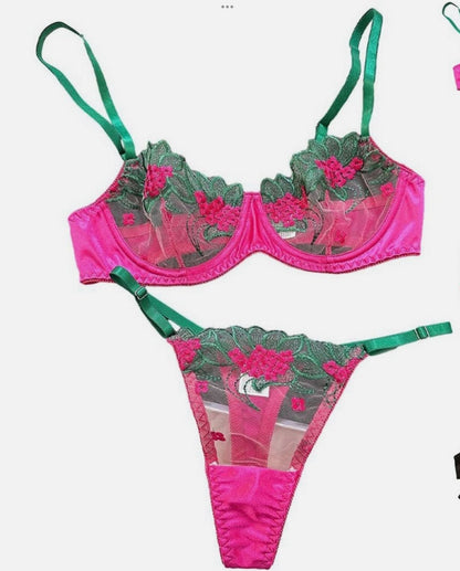 Pink and green bikini set with floral design on a white background