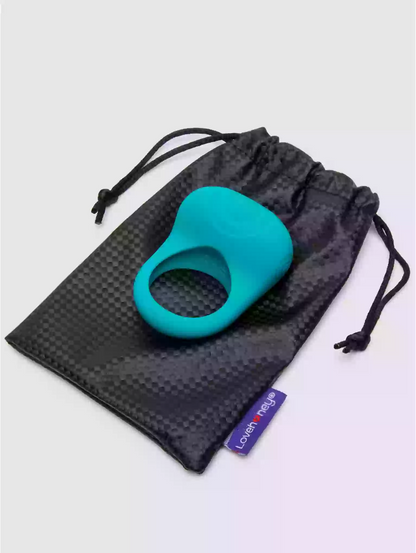 Turquoise silicone ring in a black drawstring bag on a light gray background
