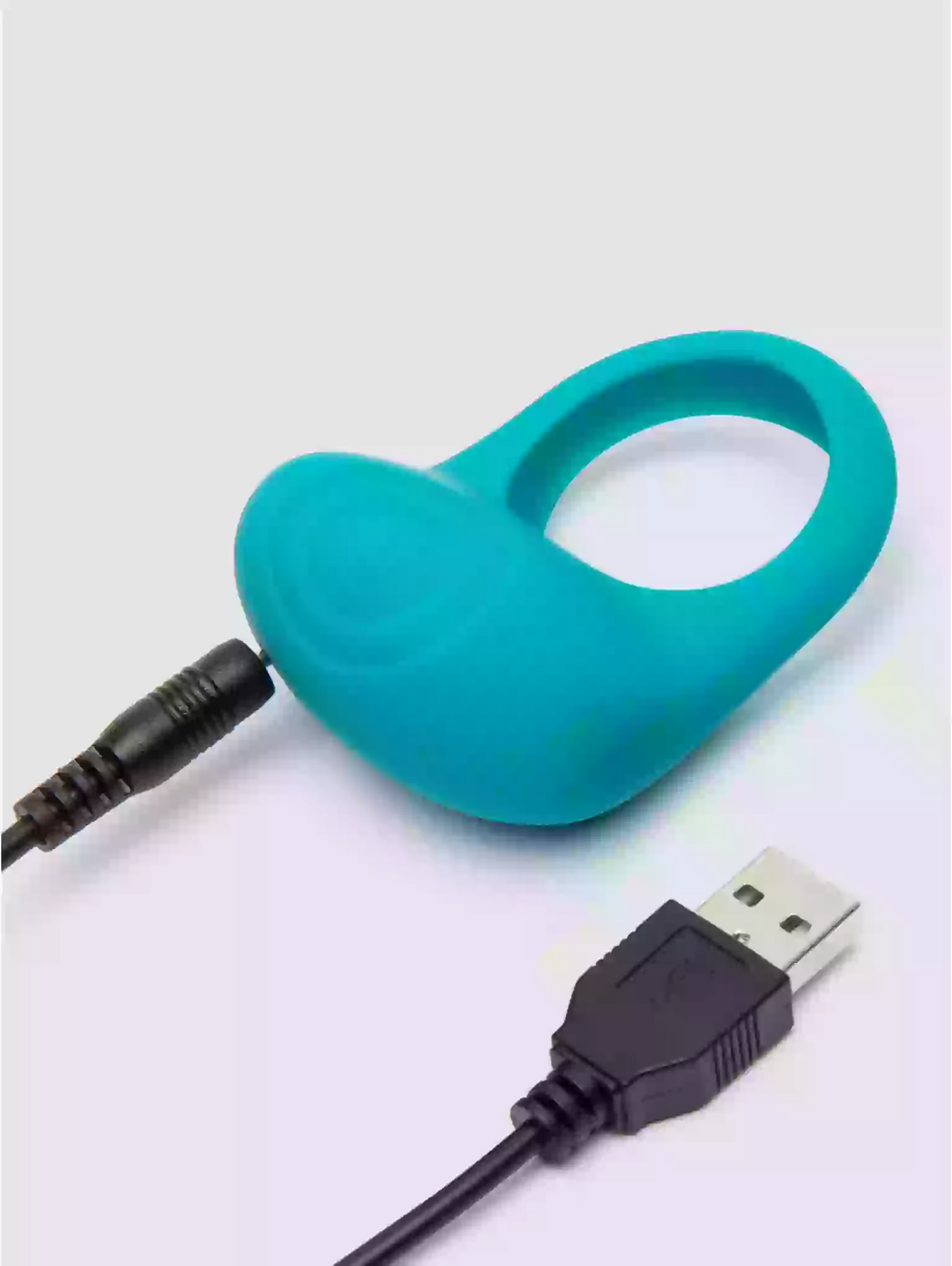 Turquoise silicone device with USB cable on a light gray background