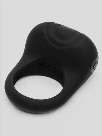 Black silicone ring with brand logo on a light gray background