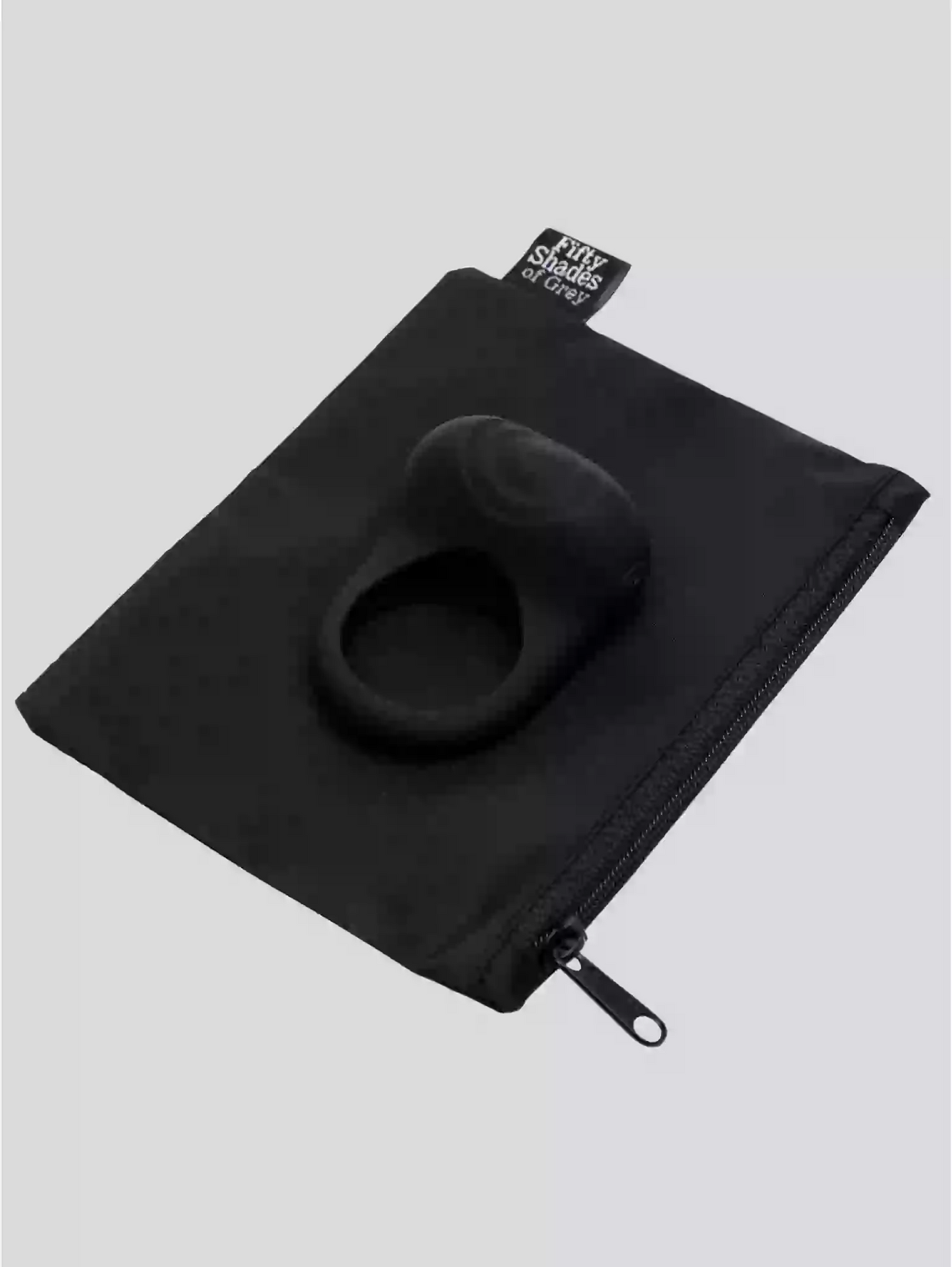 Black travel pillow in a black pouch on a light gray background