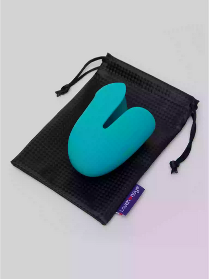 Turquoise stress ball in a black drawstring bag on a light gray background