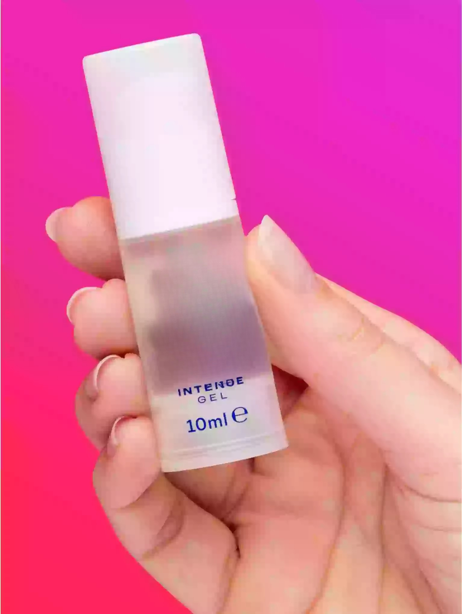 Hand holding a small bottle labeled 'Intense Gel' with a pink gradient background