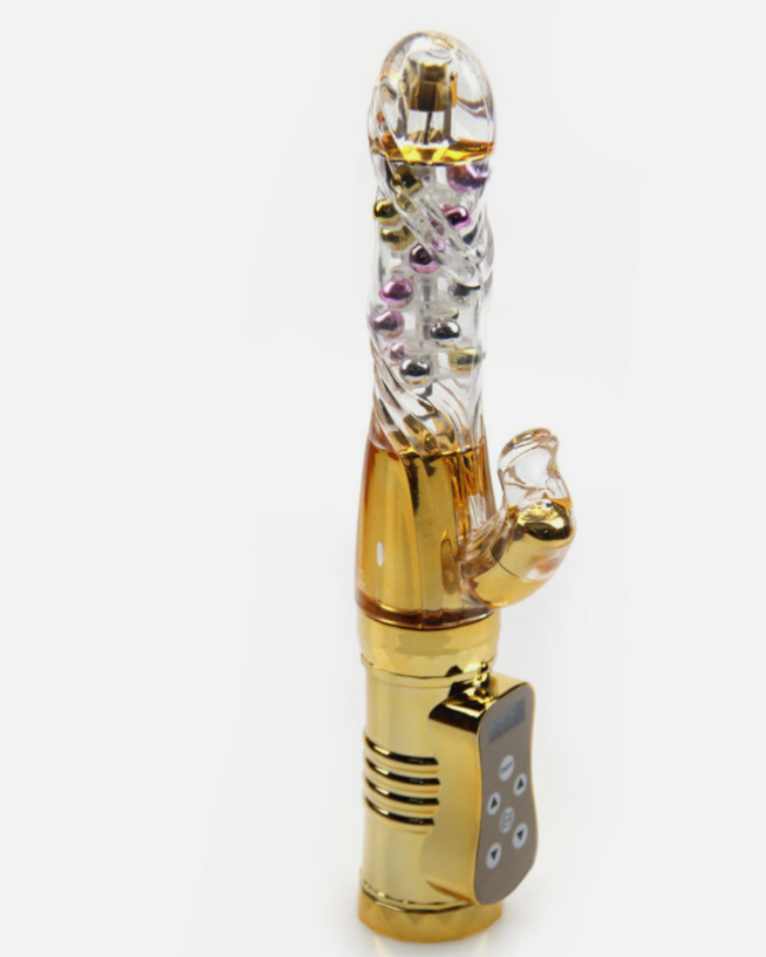 Gold and crystal smoking accessory on a white background