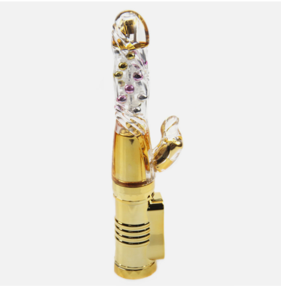 Gold and clear decorative object on a white background