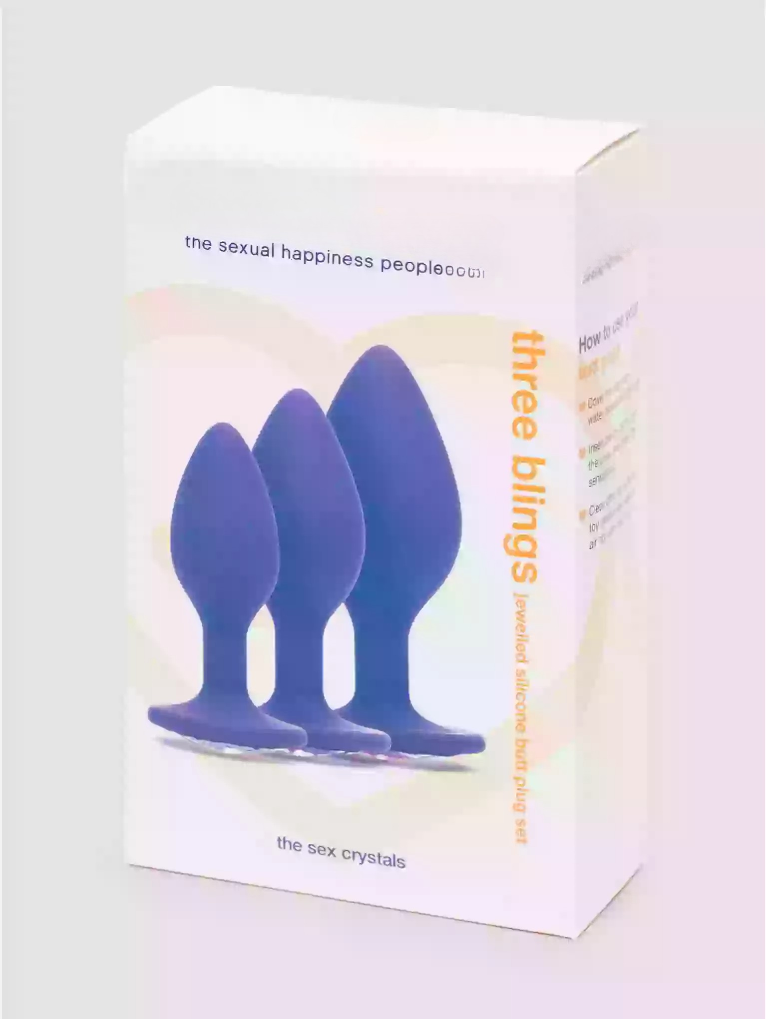Box of 'three blings' with blue sex crystals on a light gray background