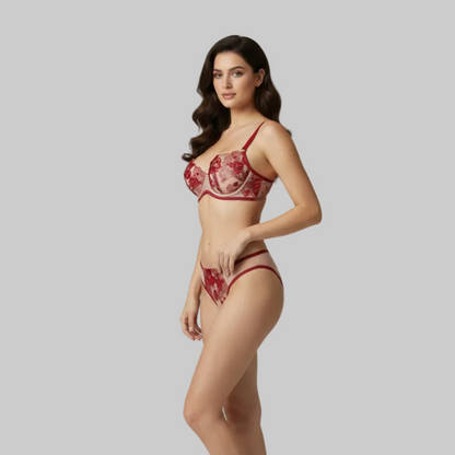 Woman wearing a red lingerie set on a gray background