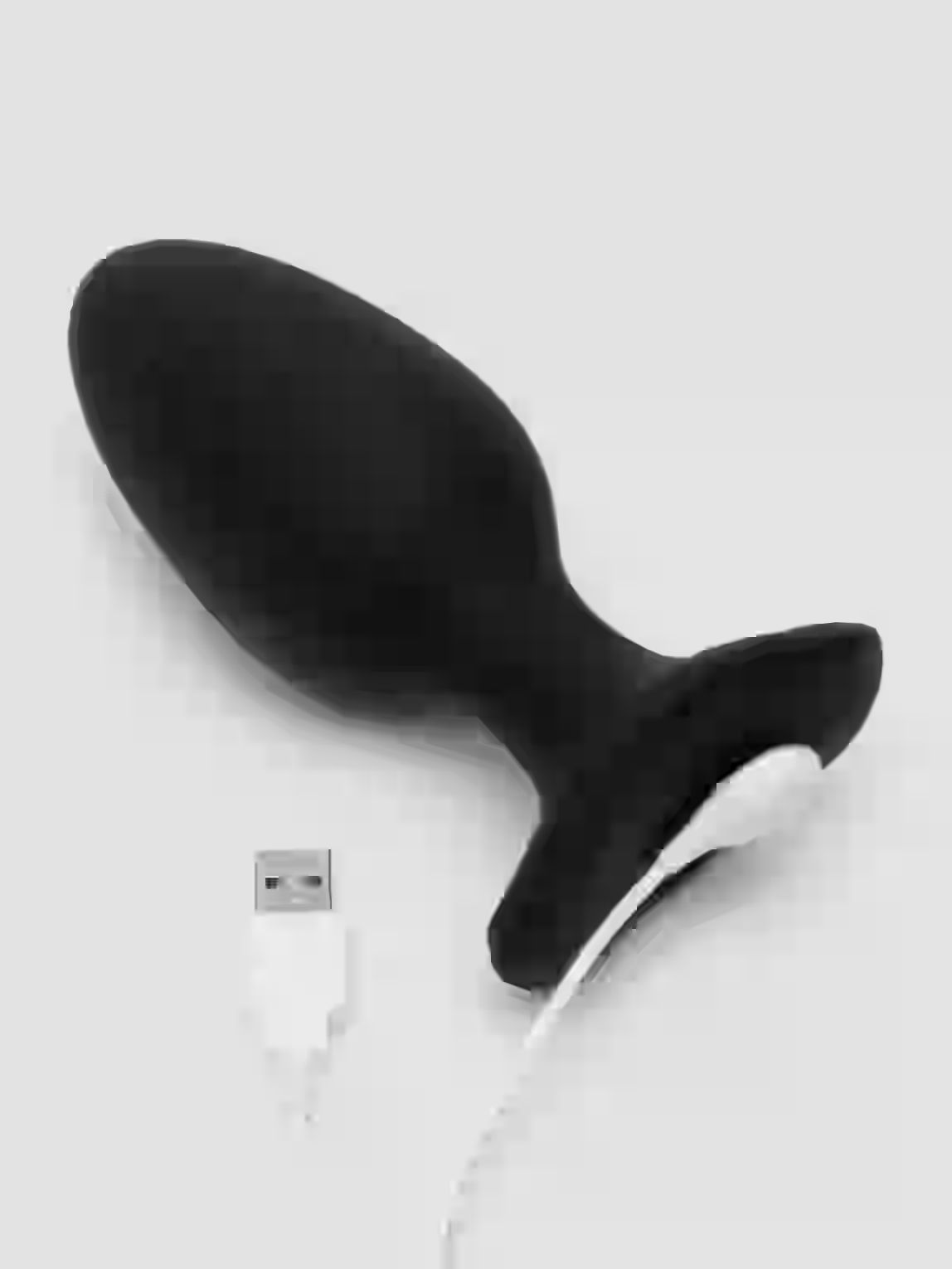 Black silicone butt plug with USB port on a white background