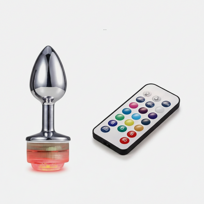 Sexual product with remote control on a white background