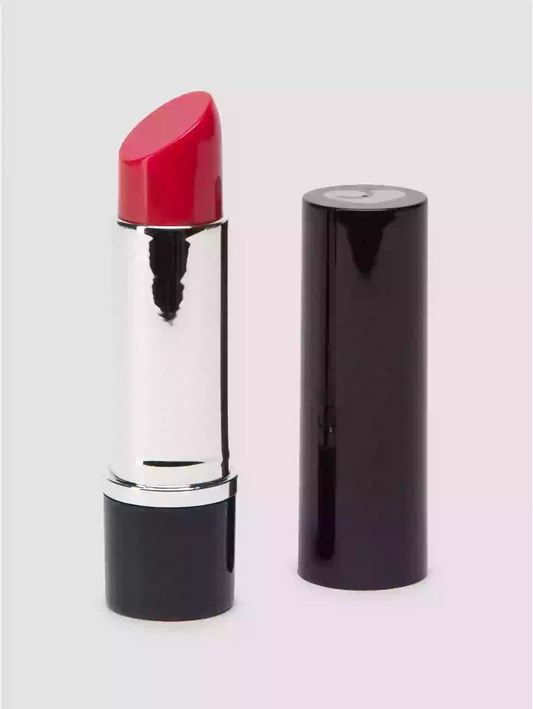 Red lipstick with black casing on a white background
