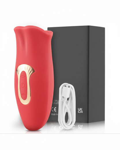 Red electronic device with gold accents and a white cable on a black box background