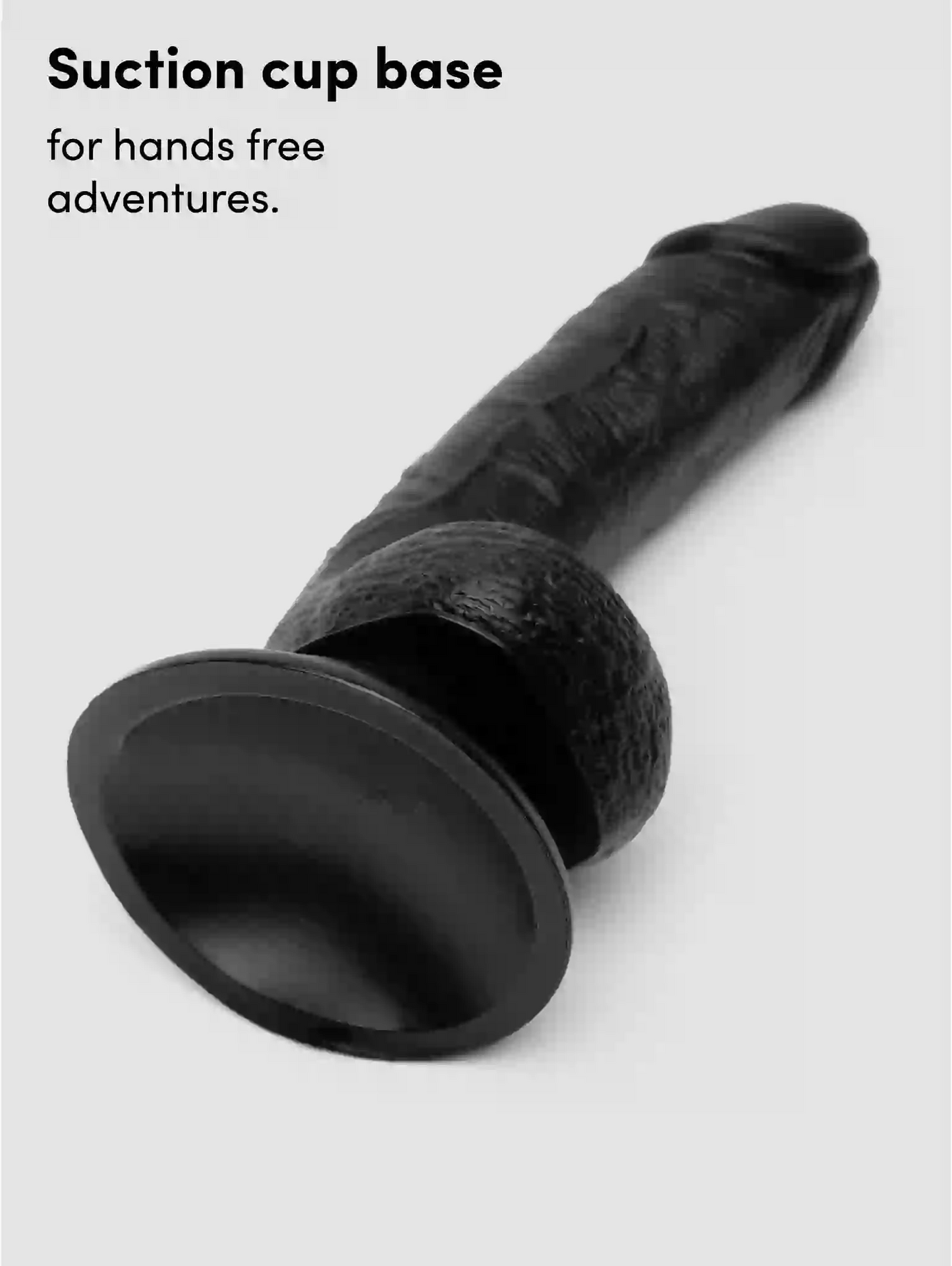 Black suction cup base on a white background with text 'Suction cup base for hands free adventures.'