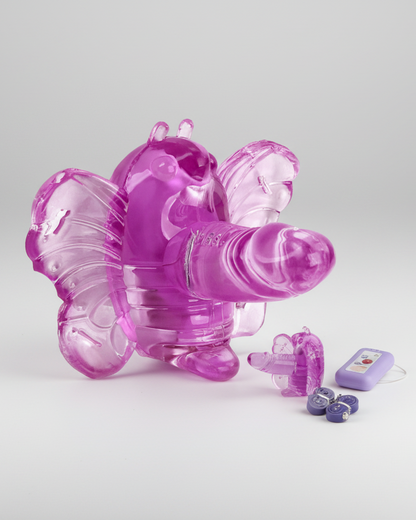 Pink butterfly-shaped toy with additional components on a light gray background