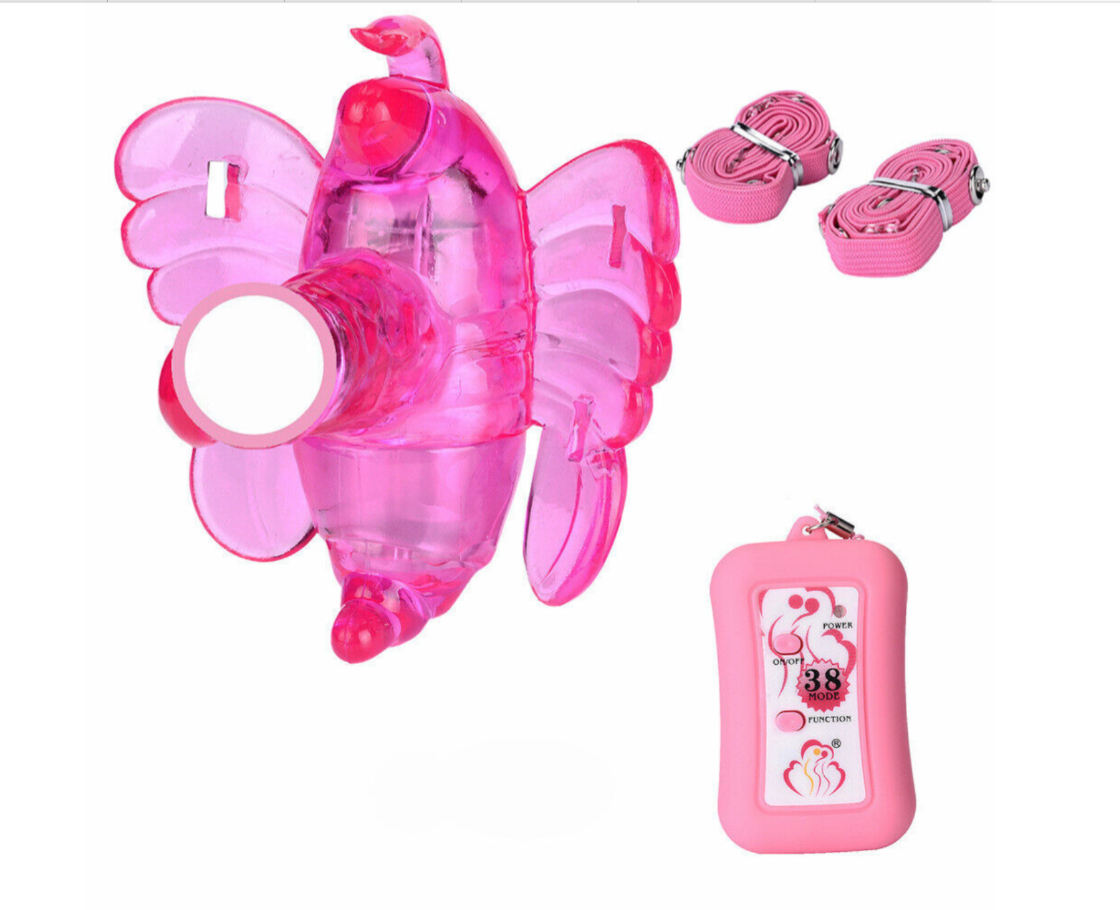 Pink butterfly-shaped product with straps and a tag on a white background